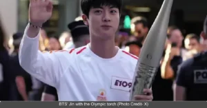 BTS Jin Carries The Olympic Torch in Paris Ahead of Summer Olympics 2024