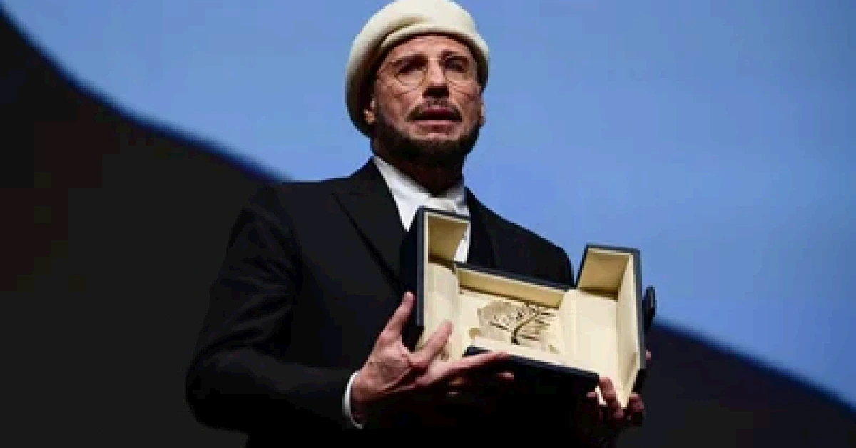 John Travolta received an honourary lifetime achievement Palm d'Or award prior to the screening of the film Propeller One-Way Night Coach at the 79th edition of the Cannes Film Festival.
